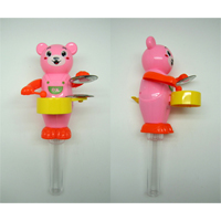 Hand Pushing Playing Drum Bear with Dextrose Candy